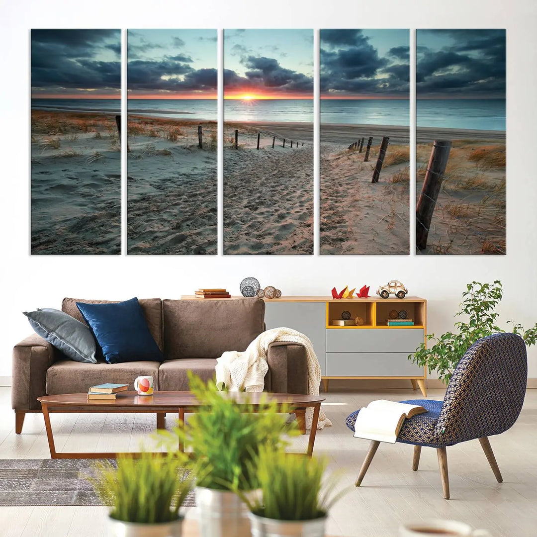 The modern living room features the Cloudy Weather Sunset Beach Wall Art Canvas Print. This museum-quality canvas adds a touch of sophistication with its hand-assembled framed art, ensuring lasting elegance. Enjoy free shipping on this exquisite piece.