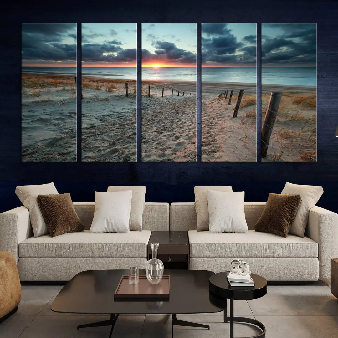 The modern living room features the Cloudy Weather Sunset Beach Wall Art Canvas Print. This museum-quality canvas adds a touch of sophistication with its hand-assembled framed art, ensuring lasting elegance. Enjoy free shipping on this exquisite piece.