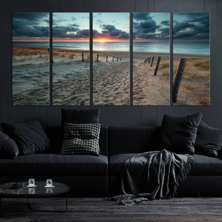 The modern living room features the Cloudy Weather Sunset Beach Wall Art Canvas Print. This museum-quality canvas adds a touch of sophistication with its hand-assembled framed art, ensuring lasting elegance. Enjoy free shipping on this exquisite piece.