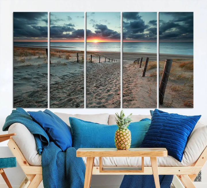 The modern living room features the Cloudy Weather Sunset Beach Wall Art Canvas Print. This museum-quality canvas adds a touch of sophistication with its hand-assembled framed art, ensuring lasting elegance. Enjoy free shipping on this exquisite piece.