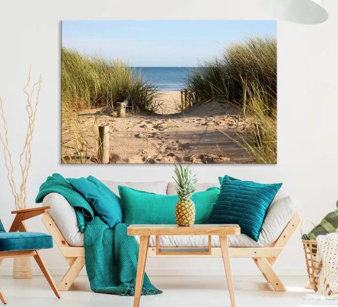 The Coastal Beach Print, showcasing a pathway to beach dunes with grass, is elegantly displayed on a gallery-wrapped museum-quality canvas. This ocean wall art canvas print features a UV-protective coating for enduring beauty.