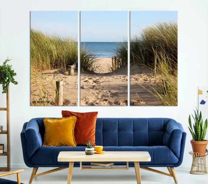 The Coastal Beach Print, showcasing a pathway to beach dunes with grass, is elegantly displayed on a gallery-wrapped museum-quality canvas. This ocean wall art canvas print features a UV-protective coating for enduring beauty.