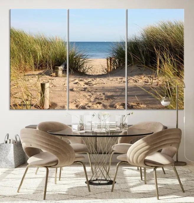 The Coastal Beach Print, showcasing a pathway to beach dunes with grass, is elegantly displayed on a gallery-wrapped museum-quality canvas. This ocean wall art canvas print features a UV-protective coating for enduring beauty.