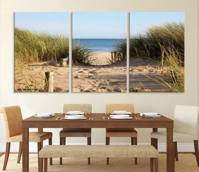 The Coastal Beach Print, showcasing a pathway to beach dunes with grass, is elegantly displayed on a gallery-wrapped museum-quality canvas. This ocean wall art canvas print features a UV-protective coating for enduring beauty.