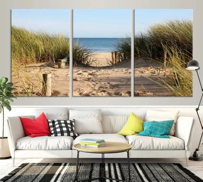 The Coastal Beach Print, showcasing a pathway to beach dunes with grass, is elegantly displayed on a gallery-wrapped museum-quality canvas. This ocean wall art canvas print features a UV-protective coating for enduring beauty.