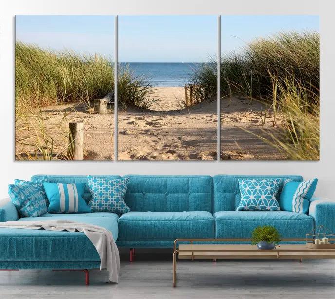 The Coastal Beach Print, showcasing a pathway to beach dunes with grass, is elegantly displayed on a gallery-wrapped museum-quality canvas. This ocean wall art canvas print features a UV-protective coating for enduring beauty.