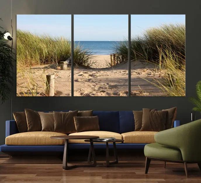 The Coastal Beach Print, showcasing a pathway to beach dunes with grass, is elegantly displayed on a gallery-wrapped museum-quality canvas. This ocean wall art canvas print features a UV-protective coating for enduring beauty.