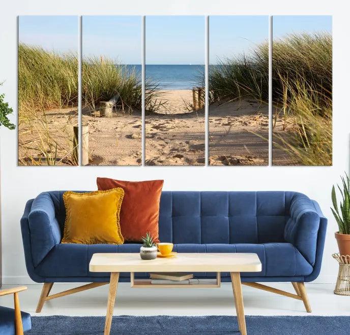 The Coastal Beach Print, showcasing a pathway to beach dunes with grass, is elegantly displayed on a gallery-wrapped museum-quality canvas. This ocean wall art canvas print features a UV-protective coating for enduring beauty.