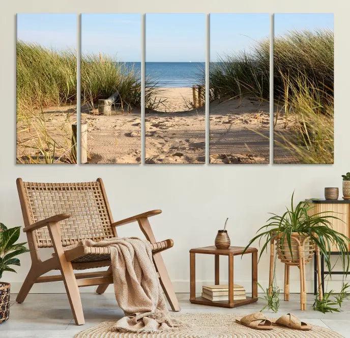 The Coastal Beach Print, showcasing a pathway to beach dunes with grass, is elegantly displayed on a gallery-wrapped museum-quality canvas. This ocean wall art canvas print features a UV-protective coating for enduring beauty.