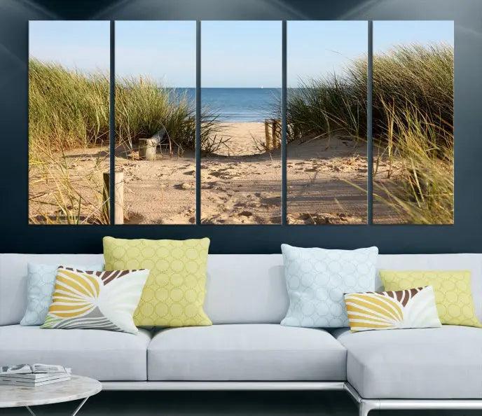 The Coastal Beach Print, showcasing a pathway to beach dunes with grass, is elegantly displayed on a gallery-wrapped museum-quality canvas. This ocean wall art canvas print features a UV-protective coating for enduring beauty.