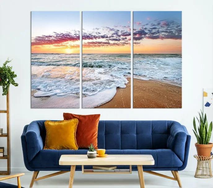 The living room features the Coastal Sunset Art Beach Canvas Wall Art Print, a large 3-panel seascape that beautifully depicts ocean waves during a beach sunset.