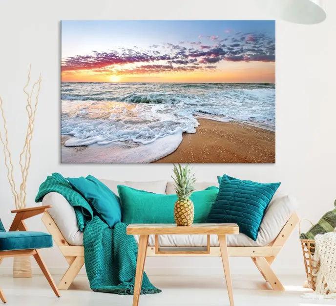 The living room features the Coastal Sunset Art Beach Canvas Wall Art Print, a large 3-panel seascape that beautifully depicts ocean waves during a beach sunset.