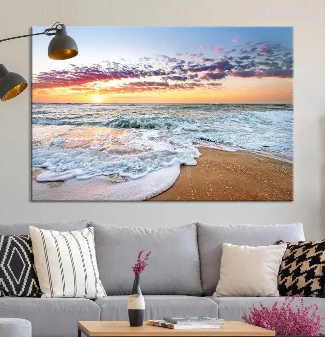 The living room features the Coastal Sunset Art Beach Canvas Wall Art Print, a large 3-panel seascape that beautifully depicts ocean waves during a beach sunset.