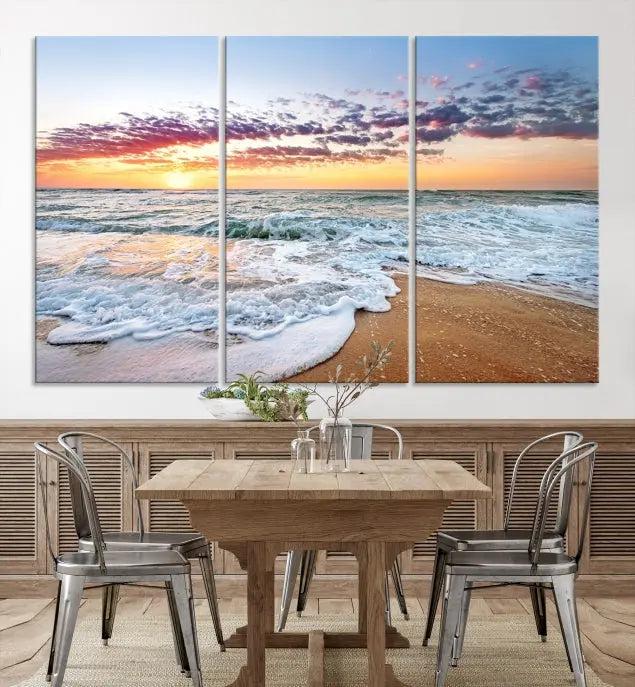 The living room features the Coastal Sunset Art Beach Canvas Wall Art Print, a large 3-panel seascape that beautifully depicts ocean waves during a beach sunset.