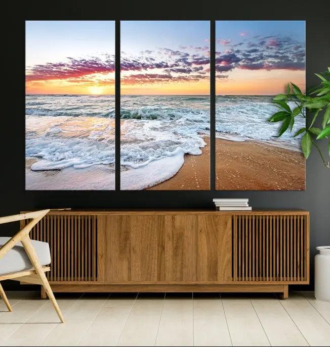 The living room features the Coastal Sunset Art Beach Canvas Wall Art Print, a large 3-panel seascape that beautifully depicts ocean waves during a beach sunset.