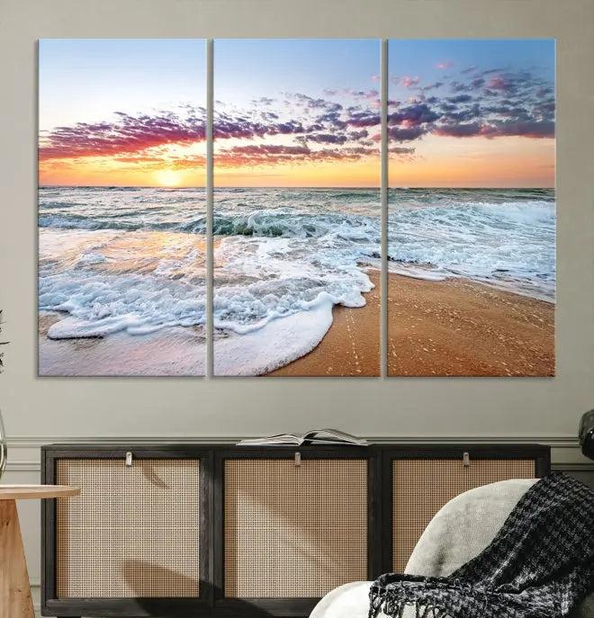 The living room features the Coastal Sunset Art Beach Canvas Wall Art Print, a large 3-panel seascape that beautifully depicts ocean waves during a beach sunset.