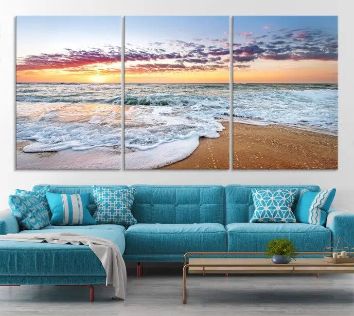 The living room features the Coastal Sunset Art Beach Canvas Wall Art Print, a large 3-panel seascape that beautifully depicts ocean waves during a beach sunset.