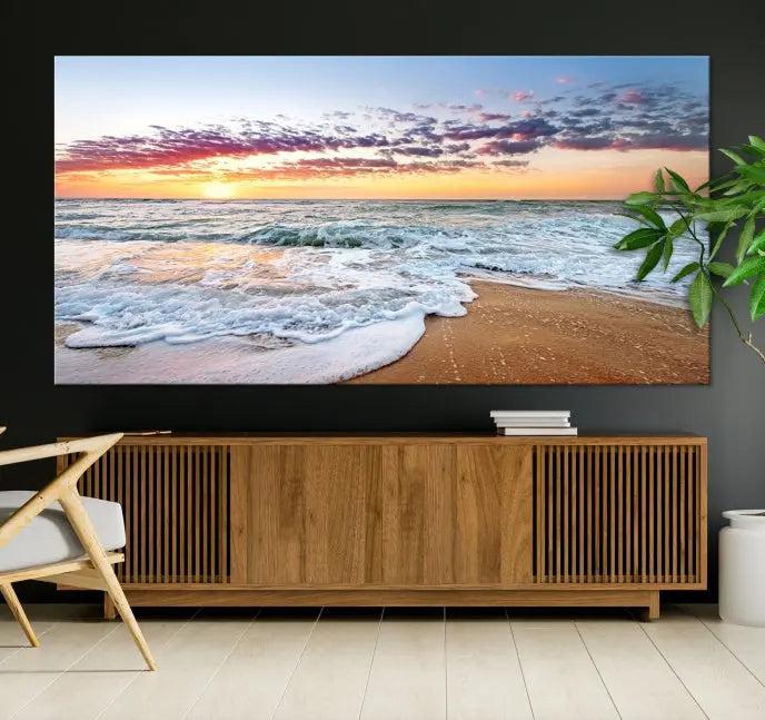 The living room features the Coastal Sunset Art Beach Canvas Wall Art Print, a large 3-panel seascape that beautifully depicts ocean waves during a beach sunset.