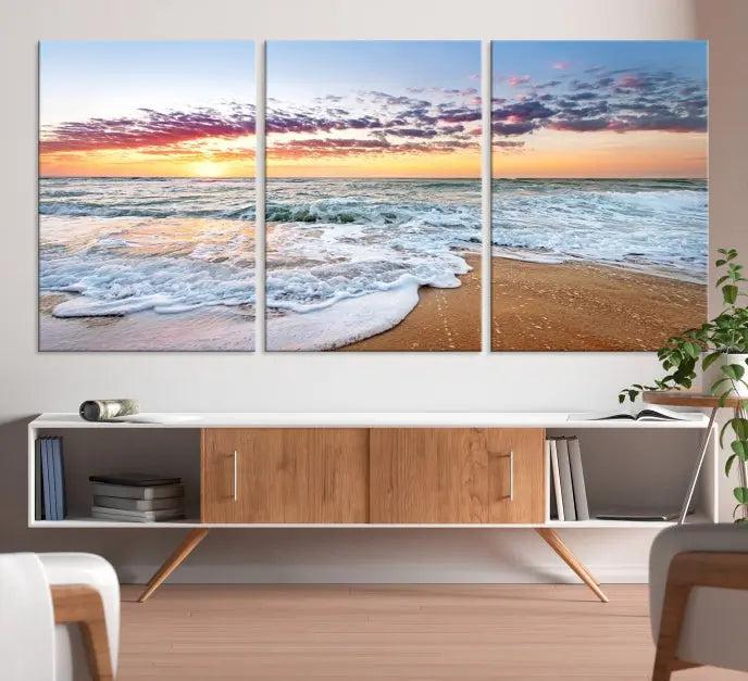 The living room features the Coastal Sunset Art Beach Canvas Wall Art Print, a large 3-panel seascape that beautifully depicts ocean waves during a beach sunset.