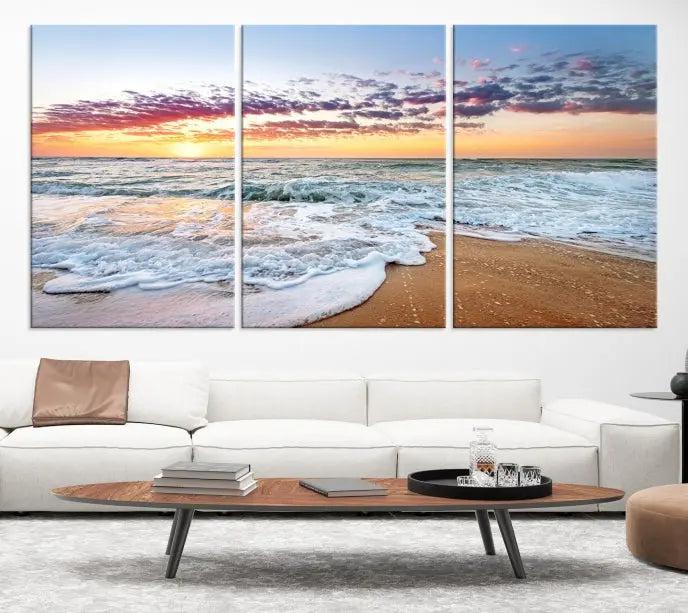 The living room features the Coastal Sunset Art Beach Canvas Wall Art Print, a large 3-panel seascape that beautifully depicts ocean waves during a beach sunset.