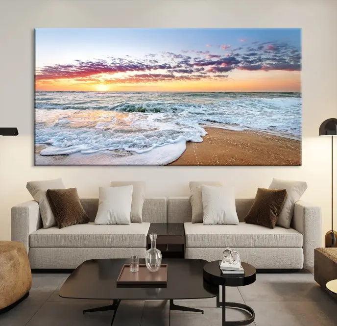 The living room features the Coastal Sunset Art Beach Canvas Wall Art Print, a large 3-panel seascape that beautifully depicts ocean waves during a beach sunset.