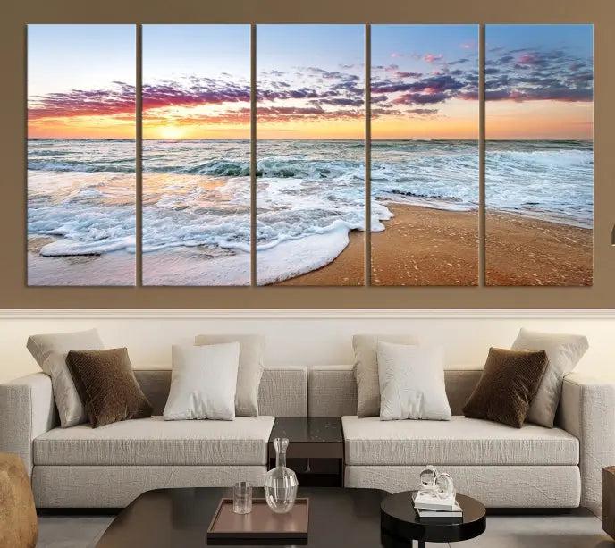 The living room features the Coastal Sunset Art Beach Canvas Wall Art Print, a large 3-panel seascape that beautifully depicts ocean waves during a beach sunset.