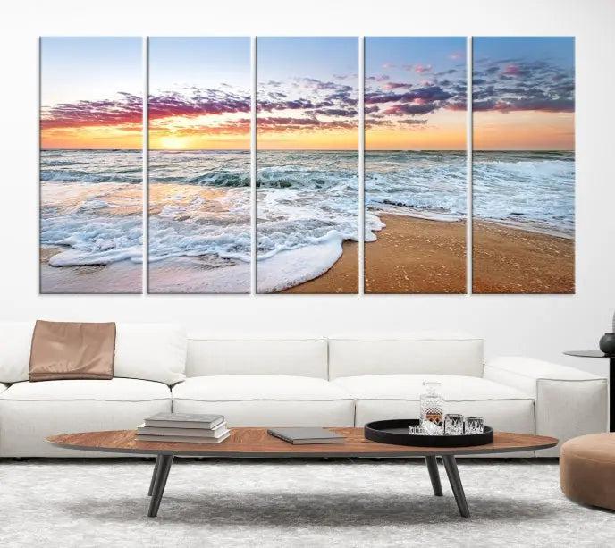 The living room features the Coastal Sunset Art Beach Canvas Wall Art Print, a large 3-panel seascape that beautifully depicts ocean waves during a beach sunset.