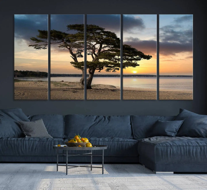 The room showcases the Coastal Sunset Wall Art Canvas Print, a triptych elegantly displayed on museum-quality polycotton canvas, depicting a serene beach sunset with a tree.