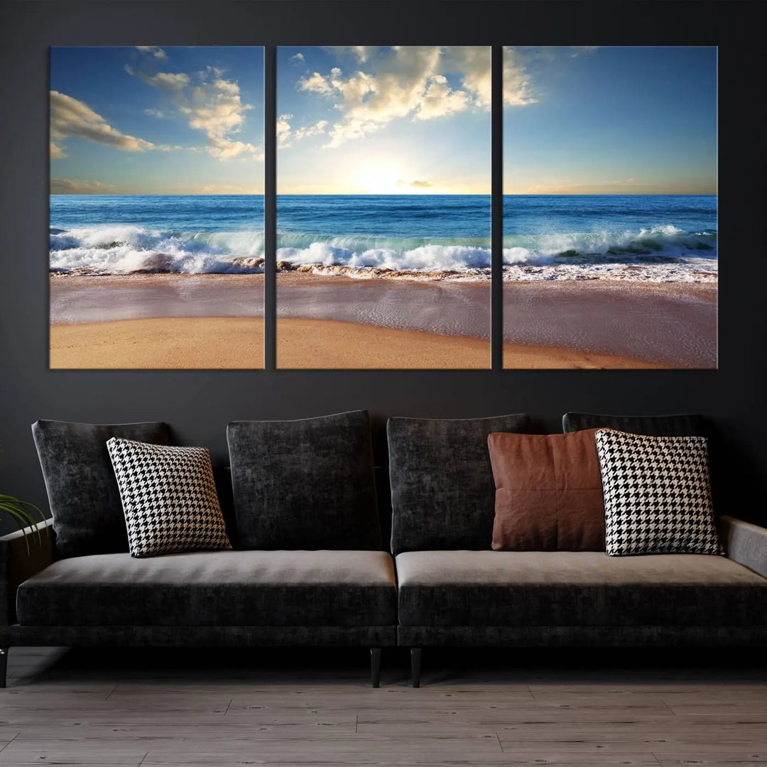 A triptych of the "Coastal Tropical Beach Sunset Canvas Wall Art Print" adorns the dark wall. Featuring a serene beach scene, its gallery-wrapped edges offer a polished look, while a UV-protective coating ensures lasting vibrancy.