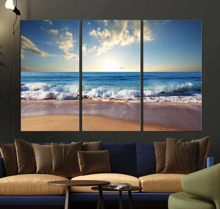 A triptych of the "Coastal Tropical Beach Sunset Canvas Wall Art Print" adorns the dark wall. Featuring a serene beach scene, its gallery-wrapped edges offer a polished look, while a UV-protective coating ensures lasting vibrancy.