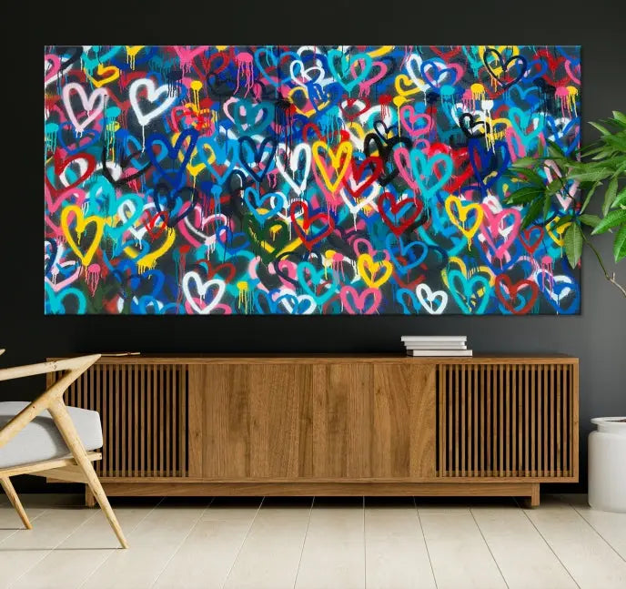 The Color Hands Wall Art Canvas Print features vibrant heart graffiti artwork on three museum-quality canvases, each expertly gallery wrapped and coated for UV protection to ensure durability.