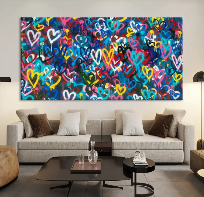 The Color Hands Wall Art Canvas Print features vibrant heart graffiti artwork on three museum-quality canvases, each expertly gallery wrapped and coated for UV protection to ensure durability.