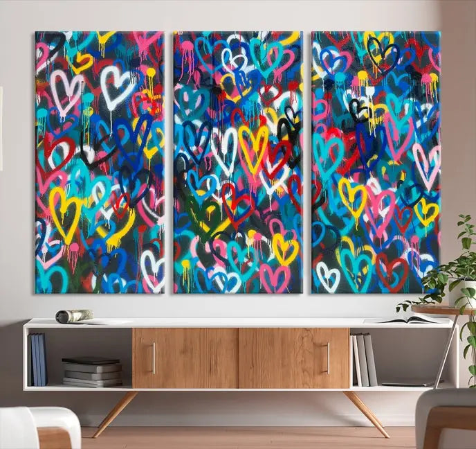 The Color Hands Wall Art Canvas Print features vibrant heart graffiti artwork on three museum-quality canvases, each expertly gallery wrapped and coated for UV protection to ensure durability.