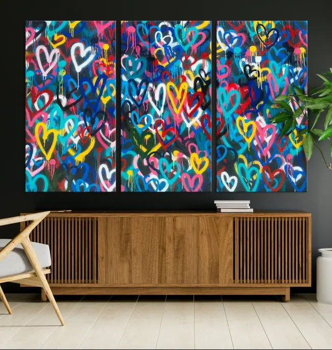 The Color Hands Wall Art Canvas Print features vibrant heart graffiti artwork on three museum-quality canvases, each expertly gallery wrapped and coated for UV protection to ensure durability.