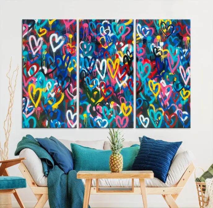 The Color Hands Wall Art Canvas Print features vibrant heart graffiti artwork on three museum-quality canvases, each expertly gallery wrapped and coated for UV protection to ensure durability.