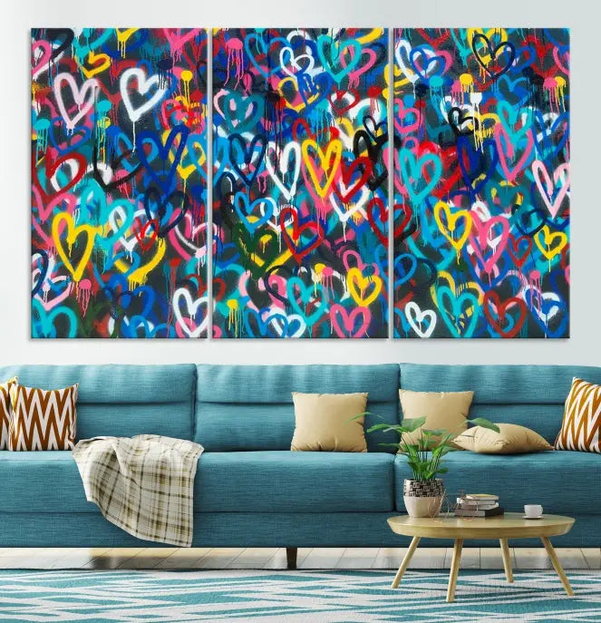 The Color Hands Wall Art Canvas Print features vibrant heart graffiti artwork on three museum-quality canvases, each expertly gallery wrapped and coated for UV protection to ensure durability.