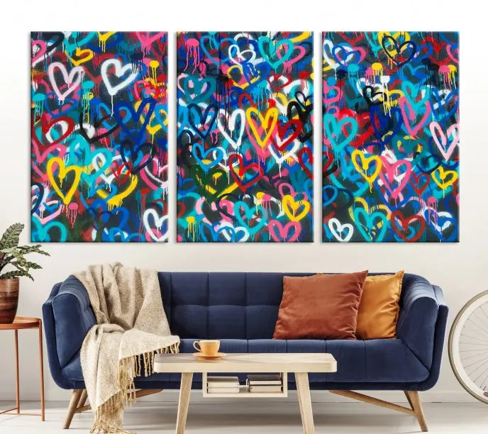 The Color Hands Wall Art Canvas Print features vibrant heart graffiti artwork on three museum-quality canvases, each expertly gallery wrapped and coated for UV protection to ensure durability.