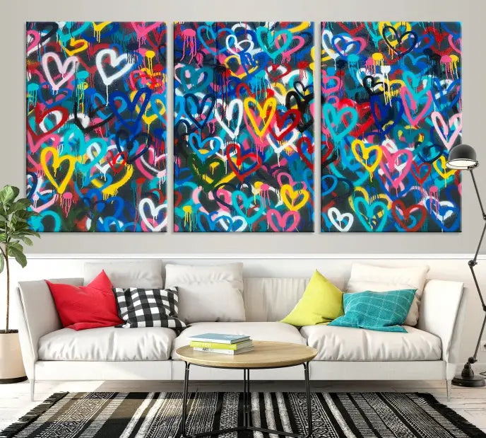 The Color Hands Wall Art Canvas Print features vibrant heart graffiti artwork on three museum-quality canvases, each expertly gallery wrapped and coated for UV protection to ensure durability.