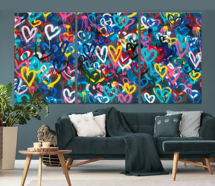 The Color Hands Wall Art Canvas Print features vibrant heart graffiti artwork on three museum-quality canvases, each expertly gallery wrapped and coated for UV protection to ensure durability.