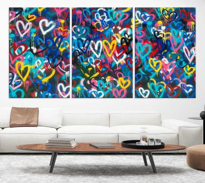 The Color Hands Wall Art Canvas Print features vibrant heart graffiti artwork on three museum-quality canvases, each expertly gallery wrapped and coated for UV protection to ensure durability.