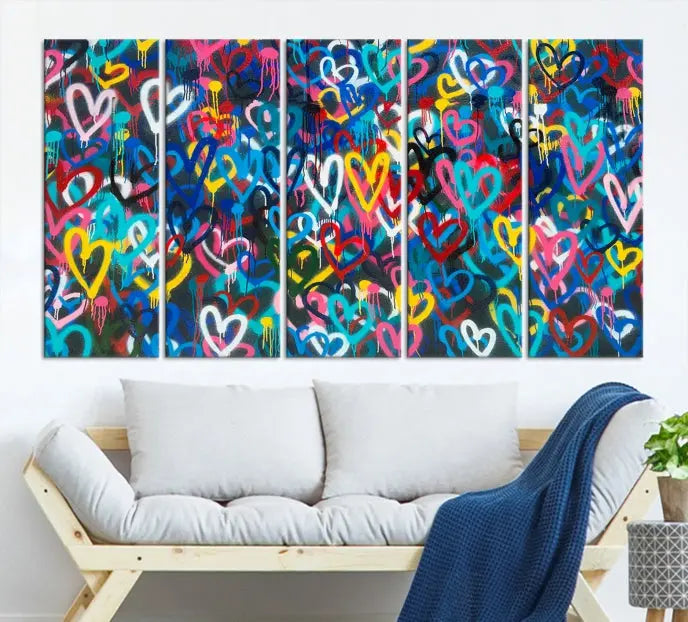 The Color Hands Wall Art Canvas Print features vibrant heart graffiti artwork on three museum-quality canvases, each expertly gallery wrapped and coated for UV protection to ensure durability.