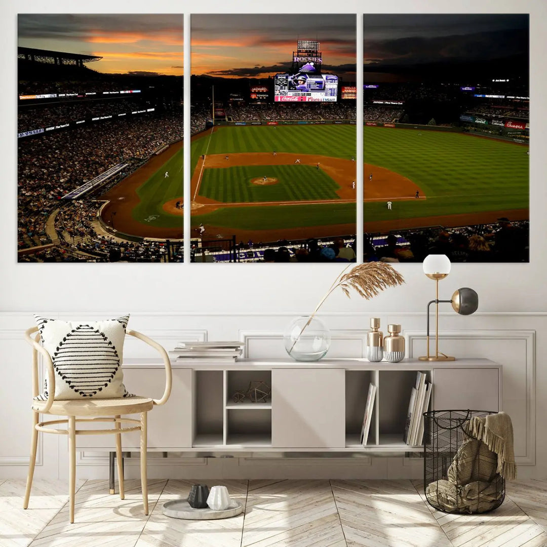 A modern living room features the Colorado Rockies Coors Field Wall Art Canvas Print, capturing the stadium at sunset with museum-quality detail.