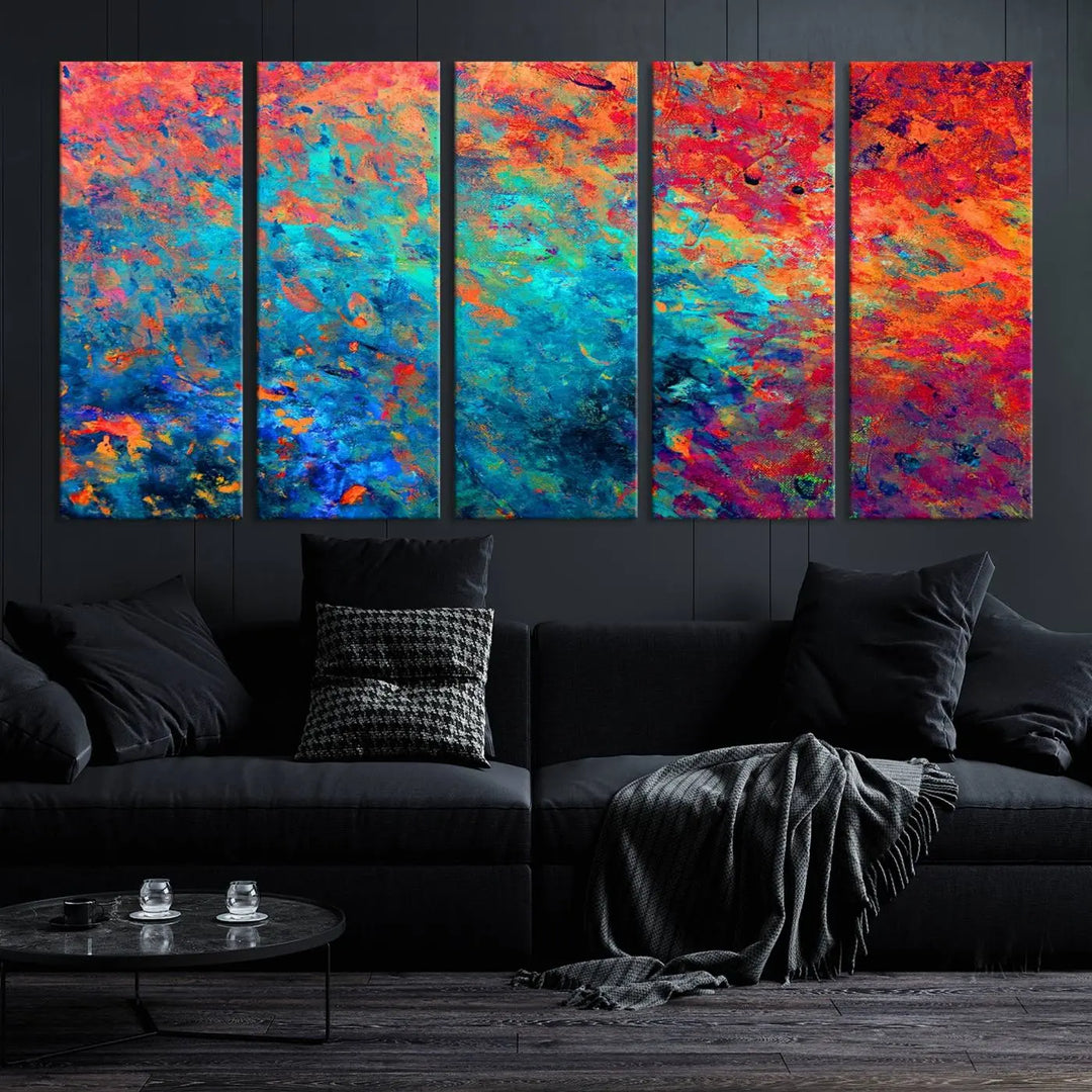 A three-part Colorful Abstract Canvas Wall Art Print, featuring vivid splashes of blue, orange, and red, is showcased on gallery-wrapped, museum-quality canvas with a UV-protective coating.