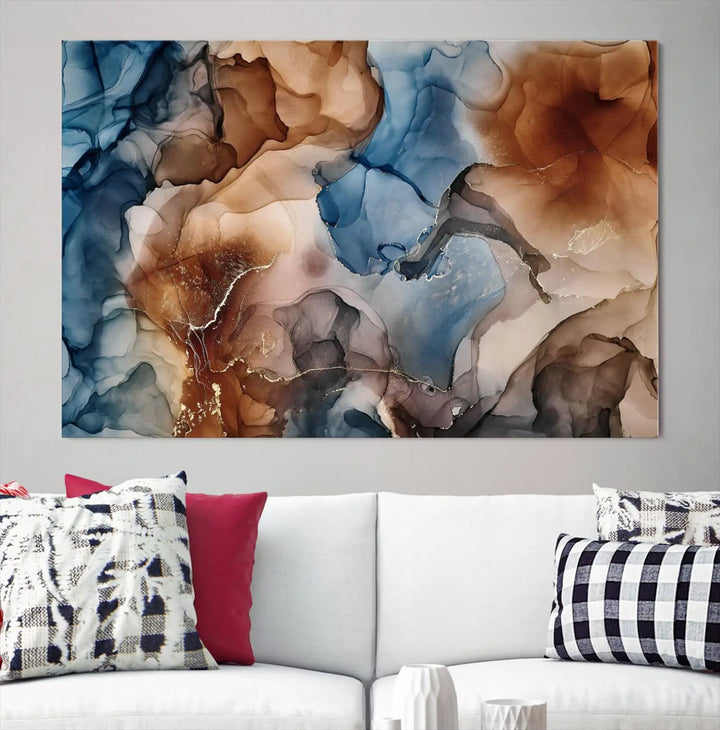 The "Colorful Abstract Clouds Canvas Wall Art Print," featuring an earthy and blue-toned color palette, hangs against a dark wall.