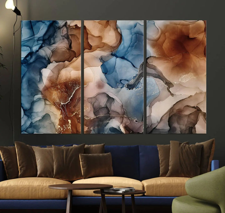 The "Colorful Abstract Clouds Canvas Wall Art Print," featuring an earthy and blue-toned color palette, hangs against a dark wall.