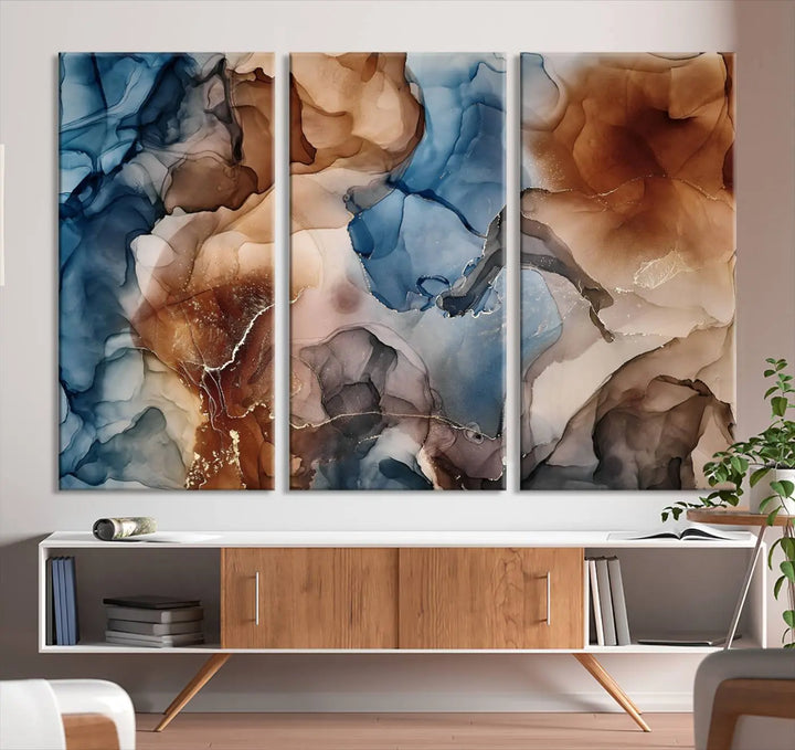 The "Colorful Abstract Clouds Canvas Wall Art Print," featuring an earthy and blue-toned color palette, hangs against a dark wall.