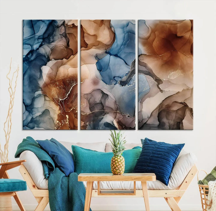 The "Colorful Abstract Clouds Canvas Wall Art Print," featuring an earthy and blue-toned color palette, hangs against a dark wall.