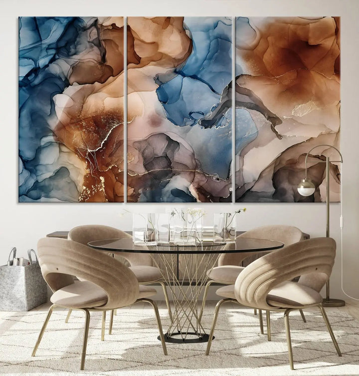 The "Colorful Abstract Clouds Canvas Wall Art Print," featuring an earthy and blue-toned color palette, hangs against a dark wall.