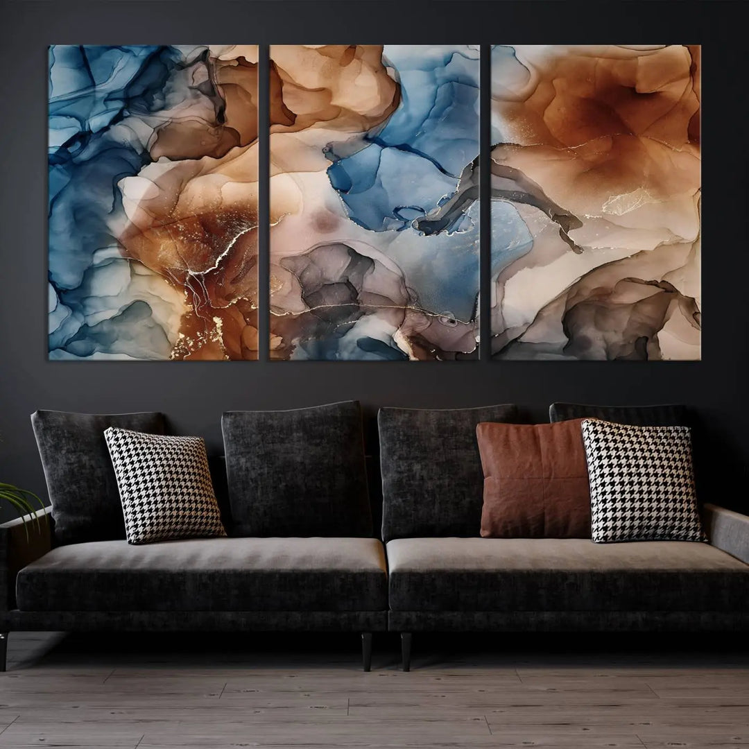 The "Colorful Abstract Clouds Canvas Wall Art Print," featuring an earthy and blue-toned color palette, hangs against a dark wall.