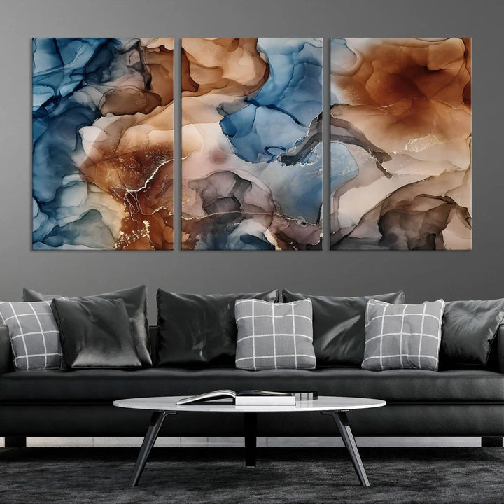 The "Colorful Abstract Clouds Canvas Wall Art Print," featuring an earthy and blue-toned color palette, hangs against a dark wall.